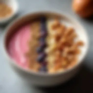 A close-up view of a smoothie bowl topped with nuts and seeds, showcasing texture.