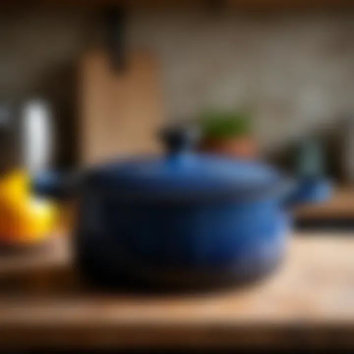 An enamel cast iron pot on a rustic kitchen countertop, showcasing its durability and design.