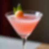 A pristine litchi martini showcasing its delicate pink hue and garnished with a litchi fruit.