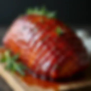 A close-up of a glazed ham, highlighting its glossy finish and garnished with herbs.