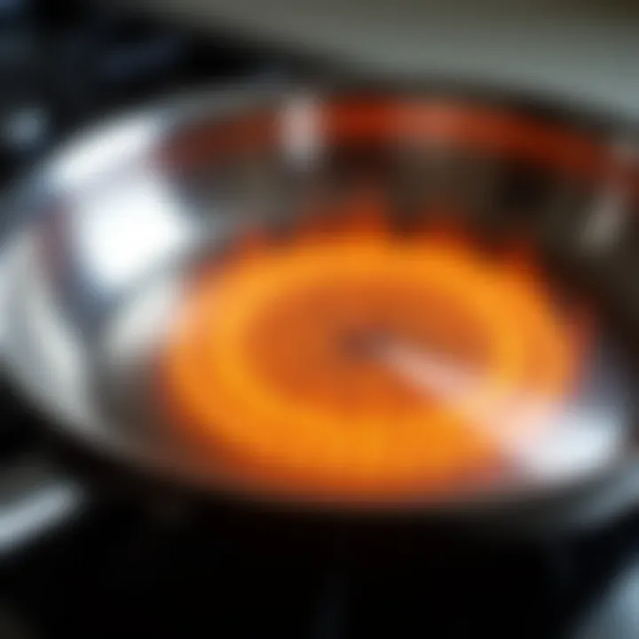 Close-up of the base of a stainless steel skillet illustrating heat distribution features