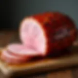 A beautifully glazed Smithfield ham on a wooden table