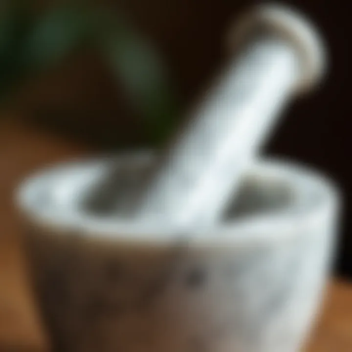 A close-up of a marble pestle resting beside the mortar, highlighting its craftsmanship.